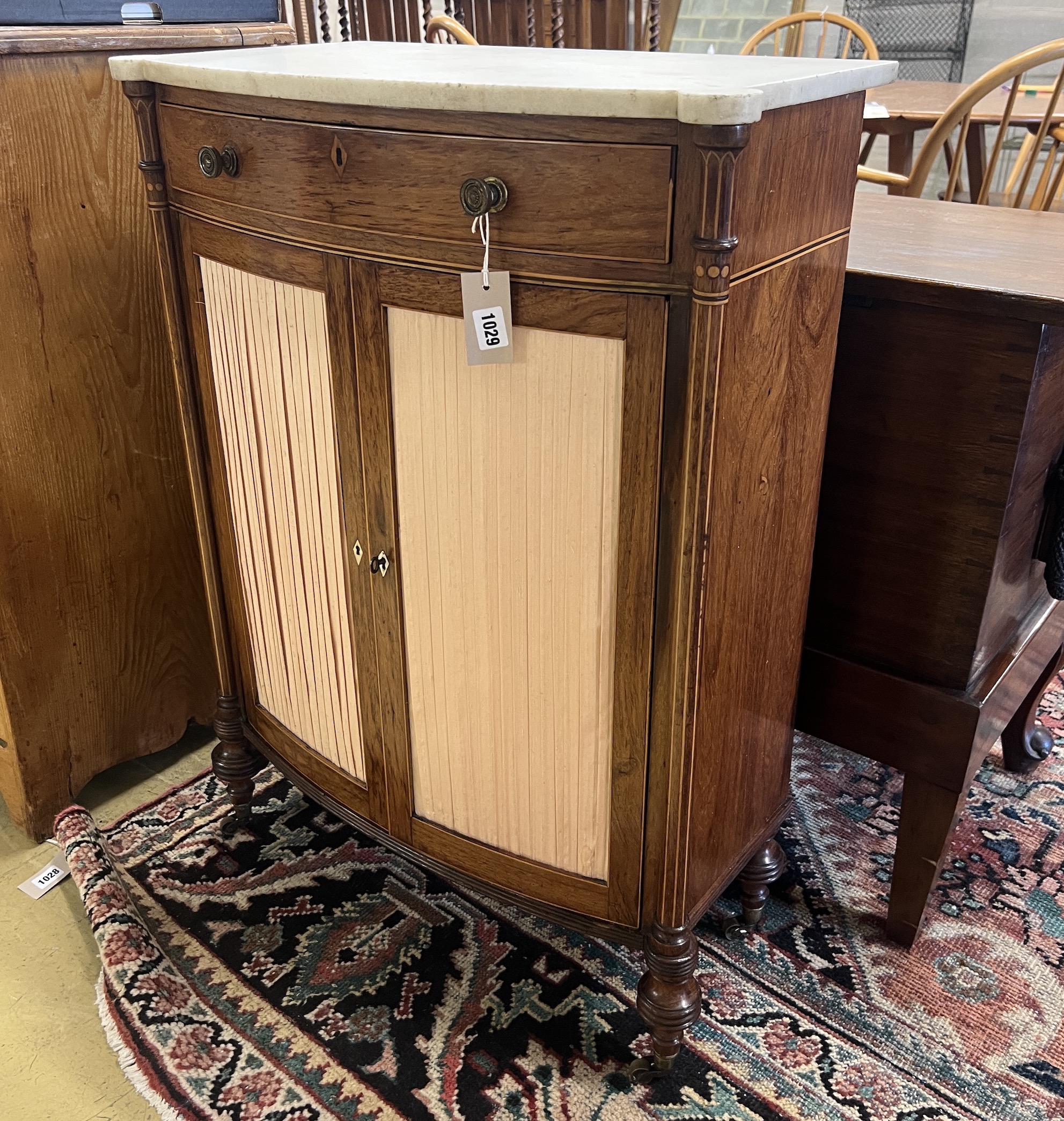 A George III Sheraton style faded rosewood bow front marble top side cabinet, width 65cm, depth 35cm, height 89cm